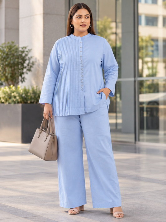 Powder blue pintuck plus-size rayon co-ord set with Mandarin-collar top and matching wide-leg trousers.
